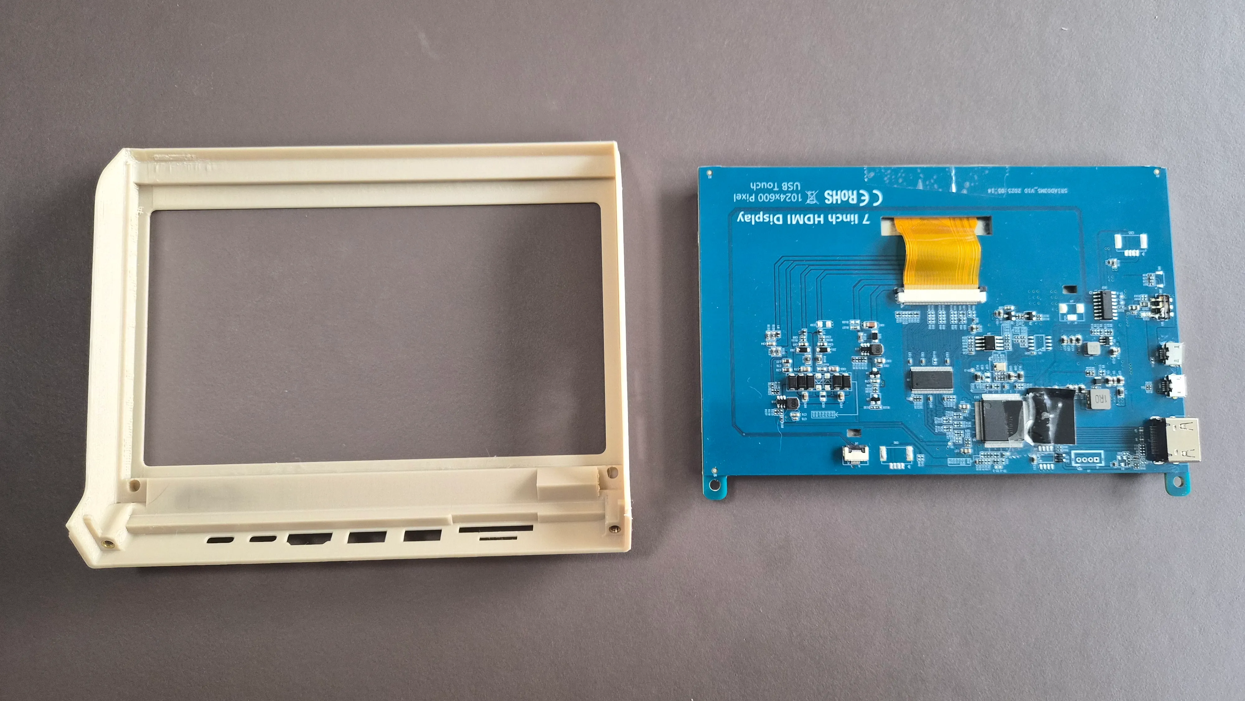 Insert the display into the faceplate. It should be a frictionfit, but optionally you can use heat-set inserts and some screws to secure it.